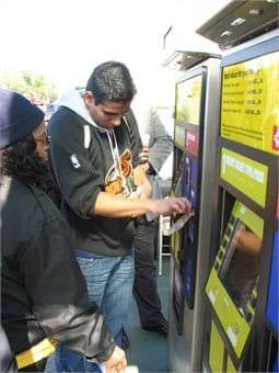 Riders purchasing tickets using Genfare's Vendstar farebox