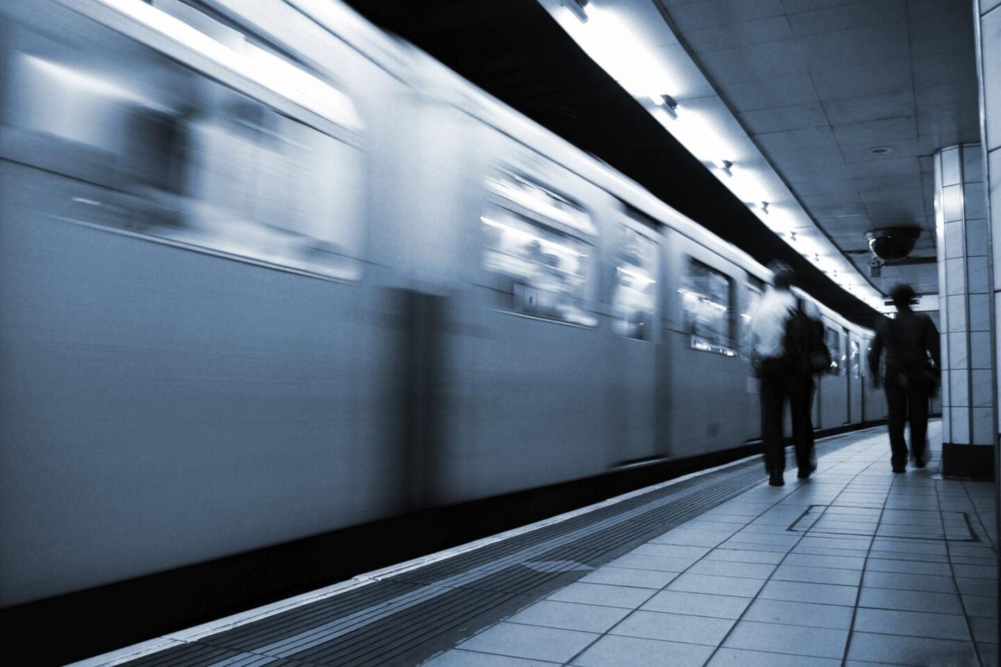 Train driving past station