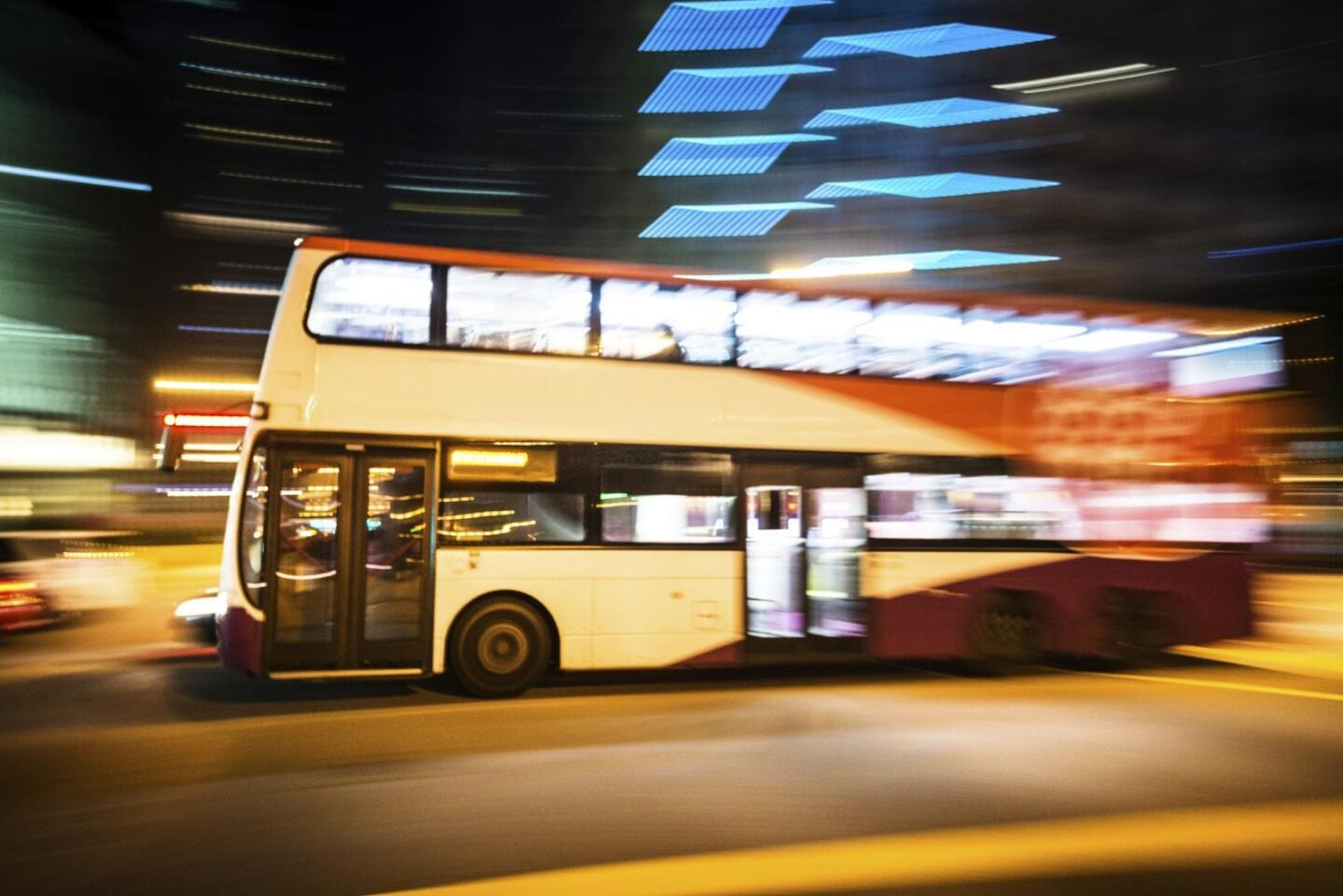 Double decker bus driving by