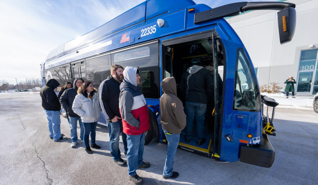 riders boarding a PACE bus