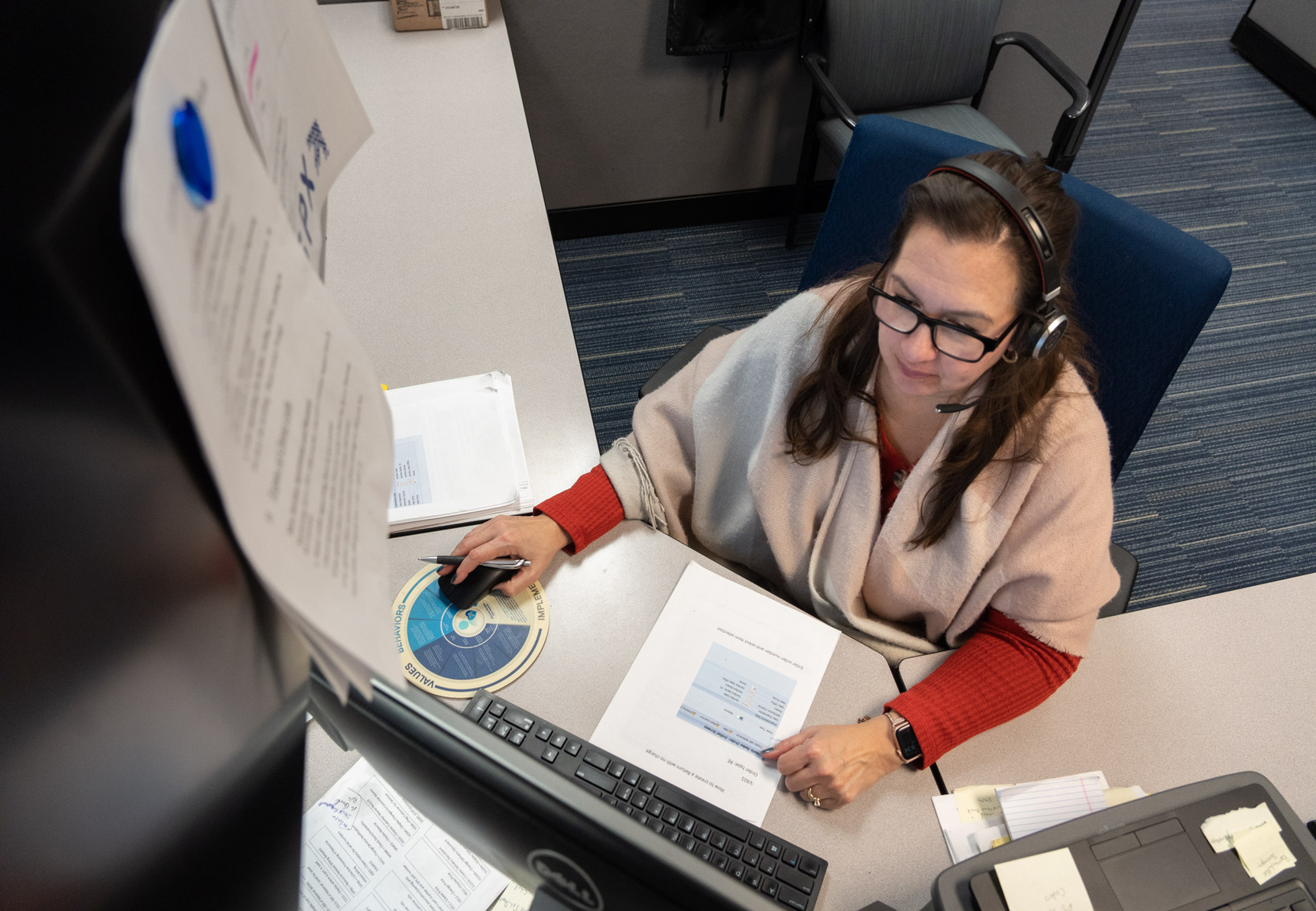 Genfare customer care partner working at desk