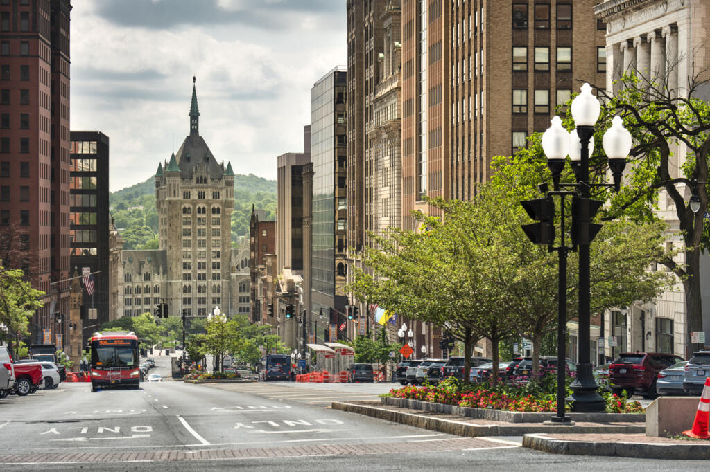 Albany, New York, USA - July 14, 2022: Bus drives down the main thoroughfare of State Street in downtown Albany the Capital city of New York State USA