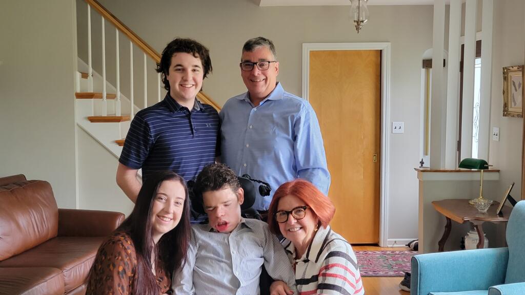 Dave Hansen with his wife and three children at home