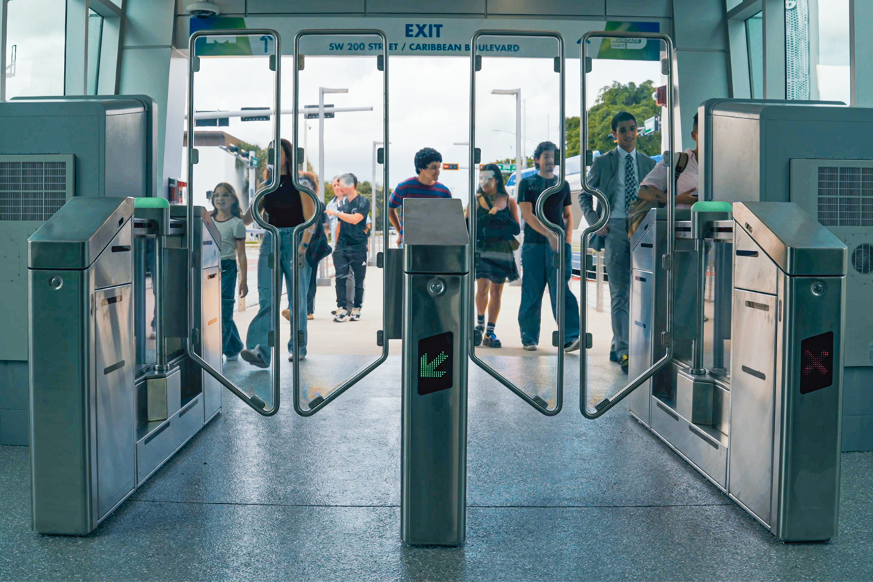 Faregates at Miami BRT station with people approaching